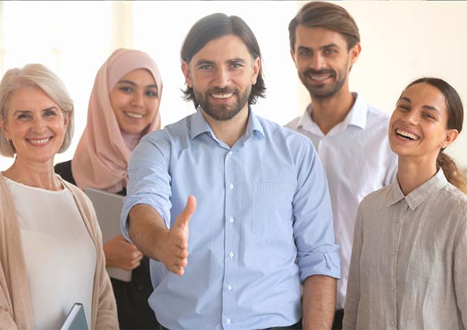 Five people looking welcoming