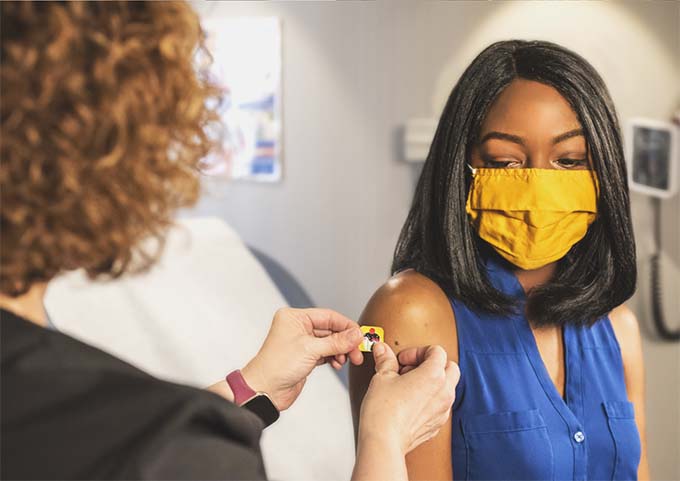 A woman receiving an injection