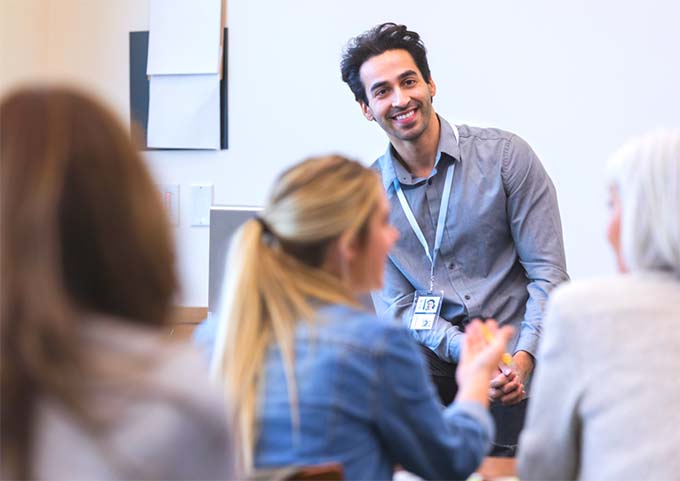 A man standing in front of a classroom