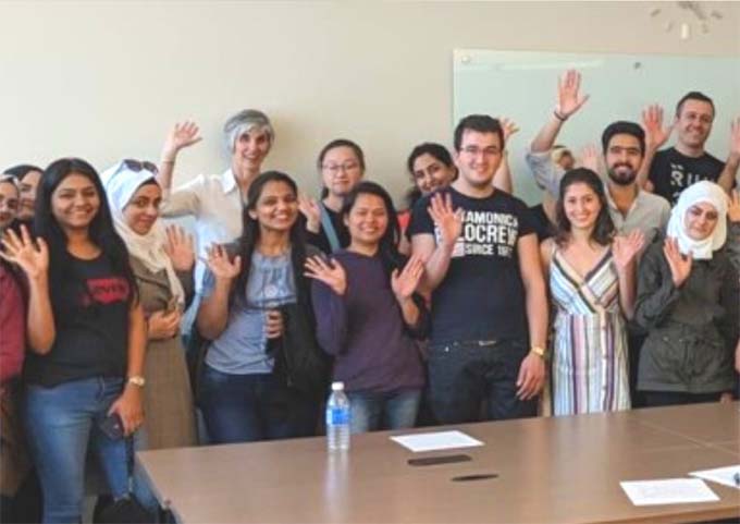 A group of people waving