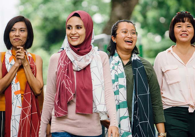 Four women walking outdoors